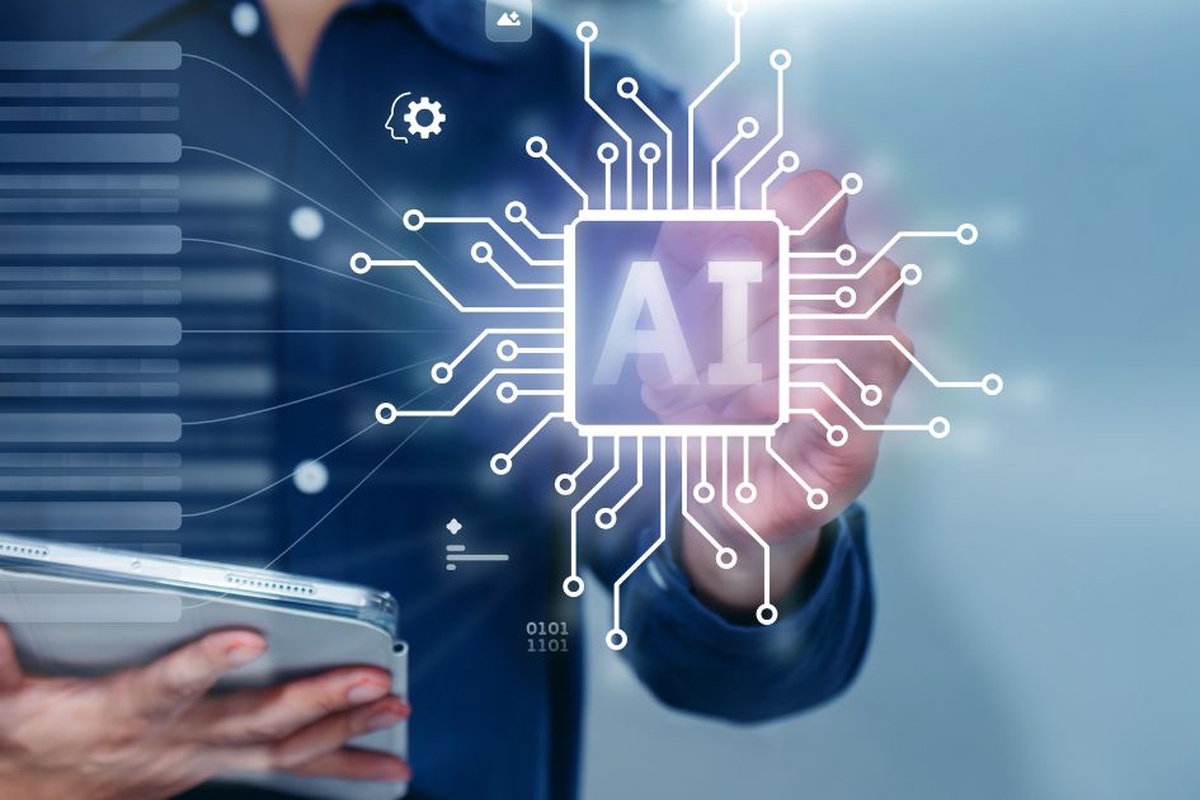 Ejecutivo usando una tablet frente a una interfaz digital que representa la adopción de agentes de IA en empresas locales.